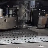 Turret punching of sheet metal at LMI workshop