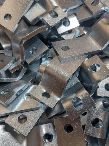 CNC machine cutting and shaping a metal component