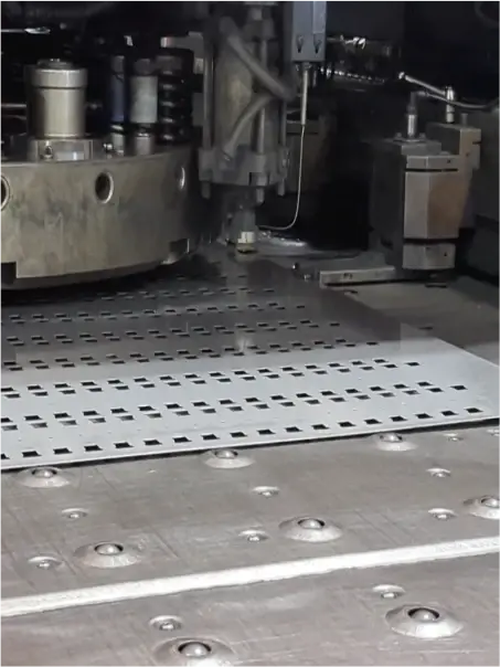 Turret punching of sheet metal at LMI workshop