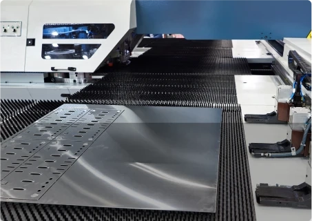 Turret punching of sheet metal at LMI workshop