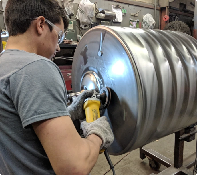 Technician working on a metal component
