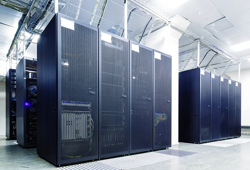 bright server room with racks of server equipment