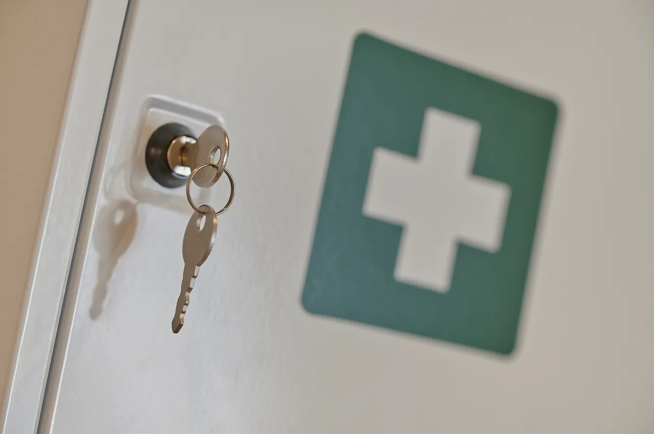 medical cabinet with a key in the cabinet lock