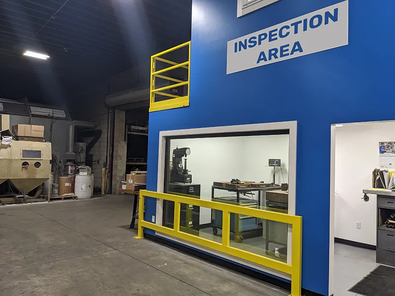 clean room with sign above door that says inspection area