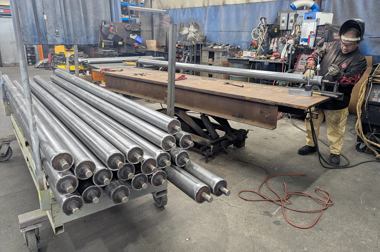 Technician cutting a metal tube