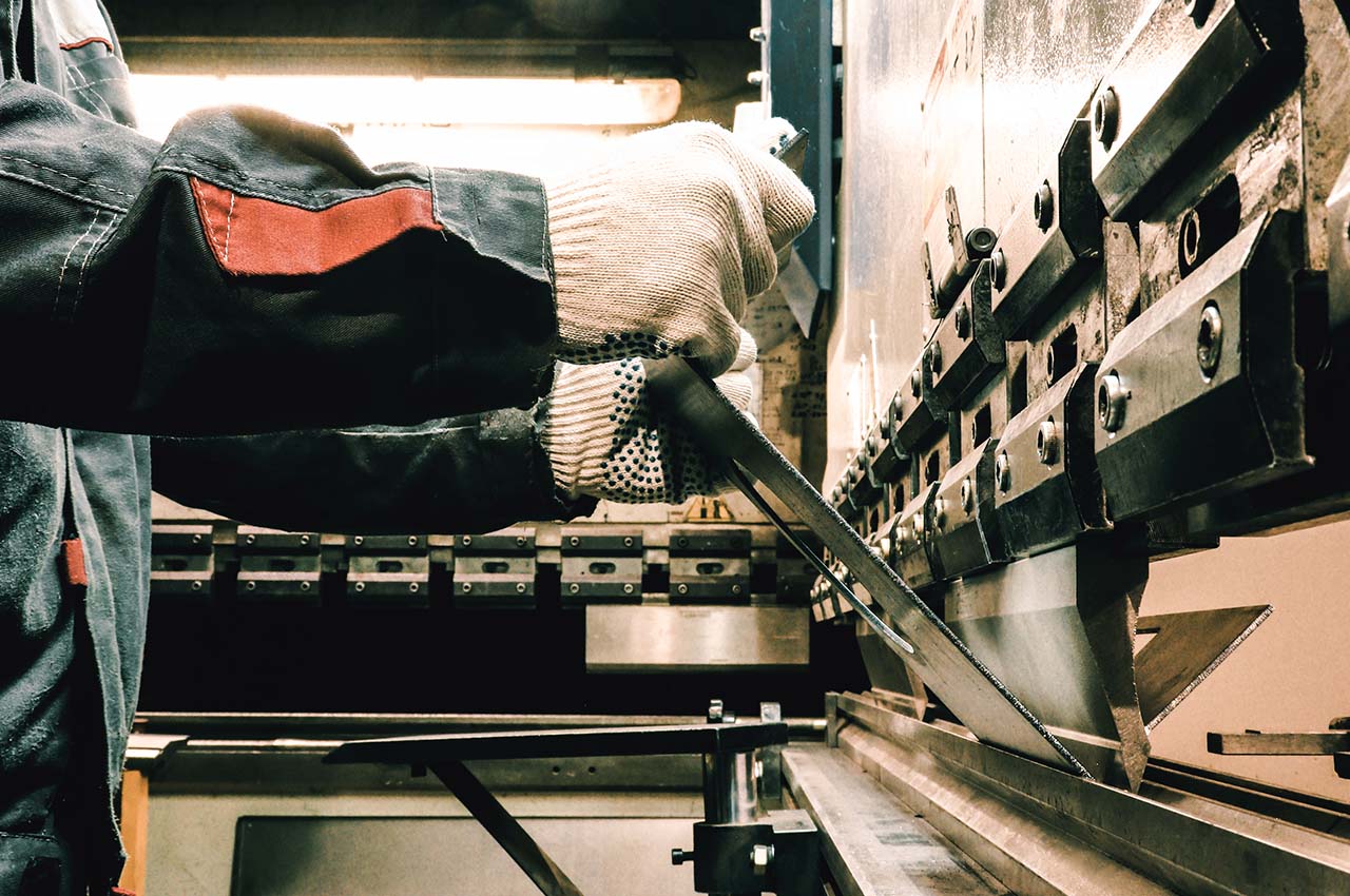 feeding sheet metal into machine