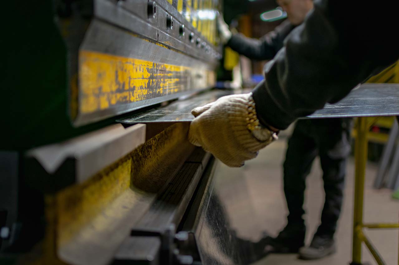 Insterting sheet metal with work gloves and a nice watch